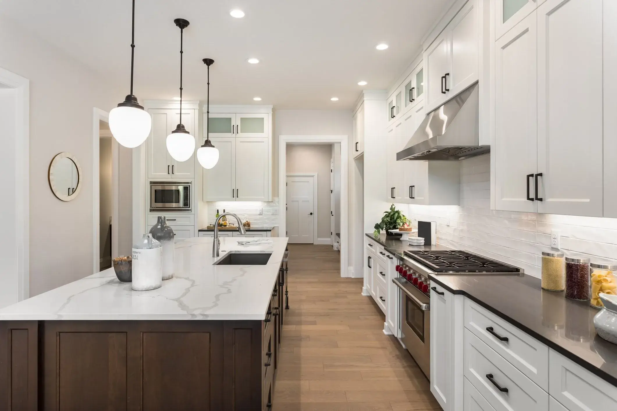 The same kitchen, now modern, open, and filled with light