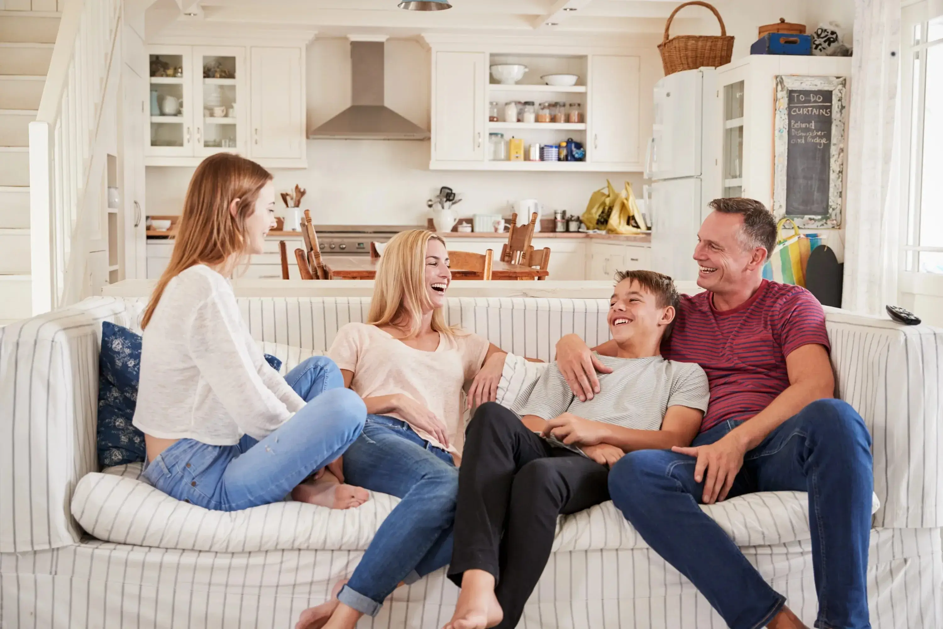 A family laughing together in a beautifully designed living room