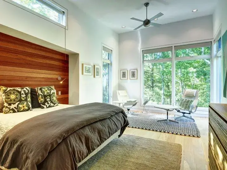 Serene bedroom with soft textiles and a view of nature