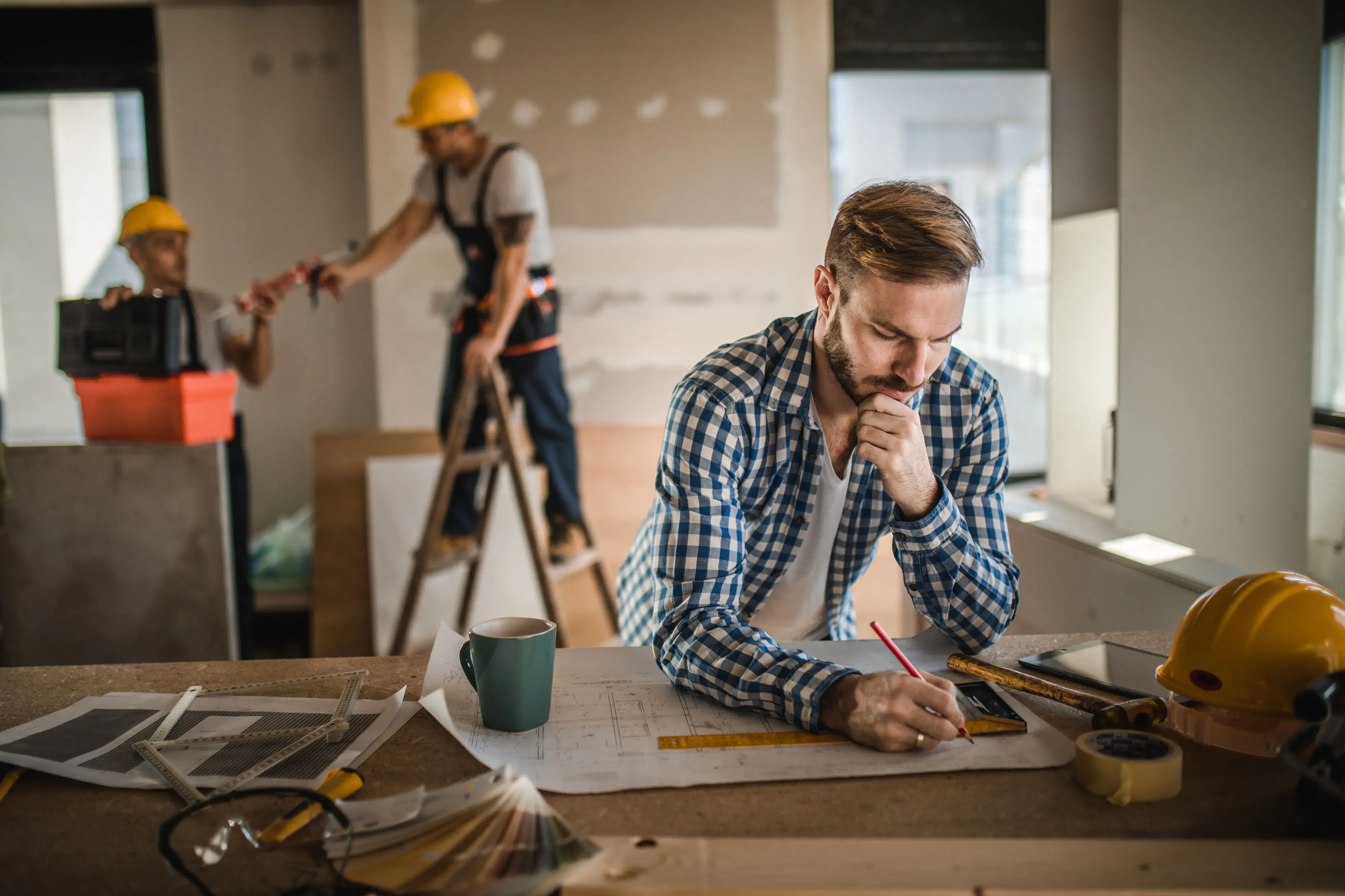 A construction site with a designer overseeing the work