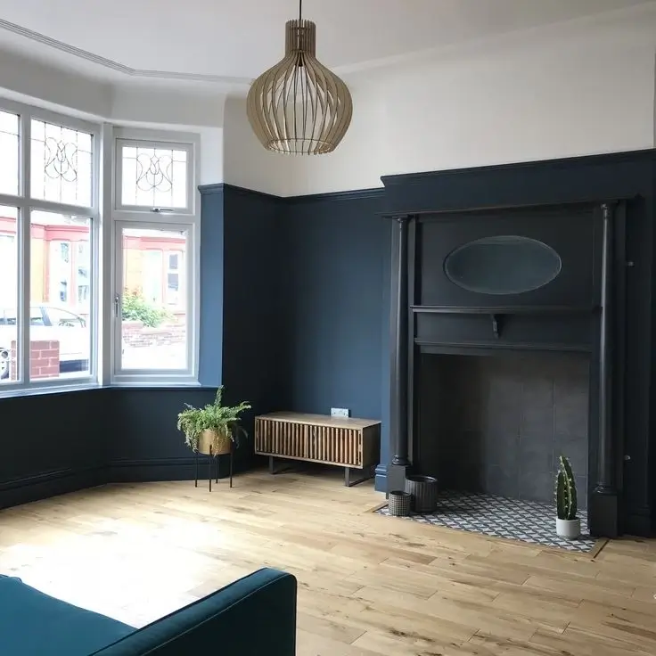 A dated, dark living room before renovation