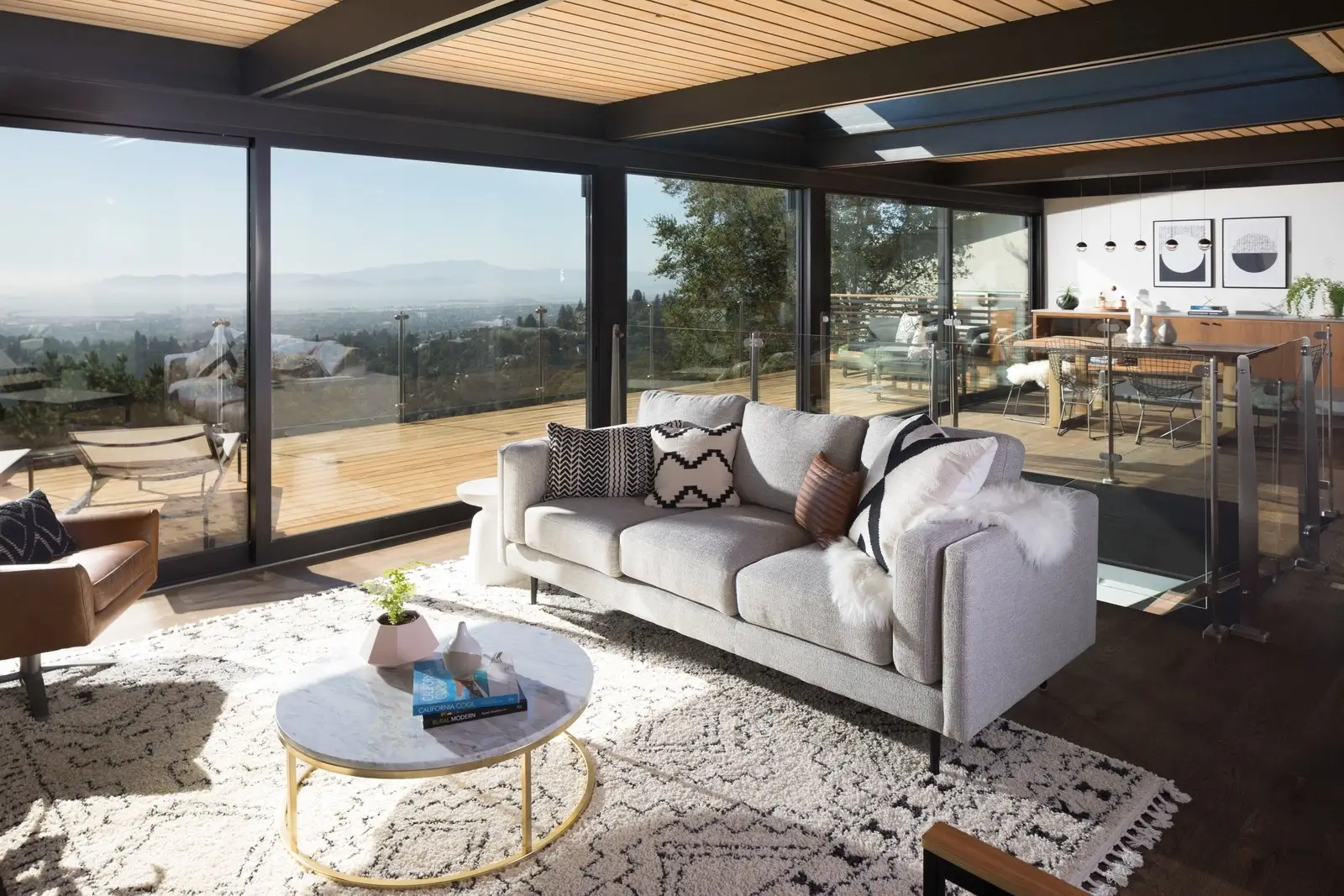 The same living room, now open and connected to the outdoors