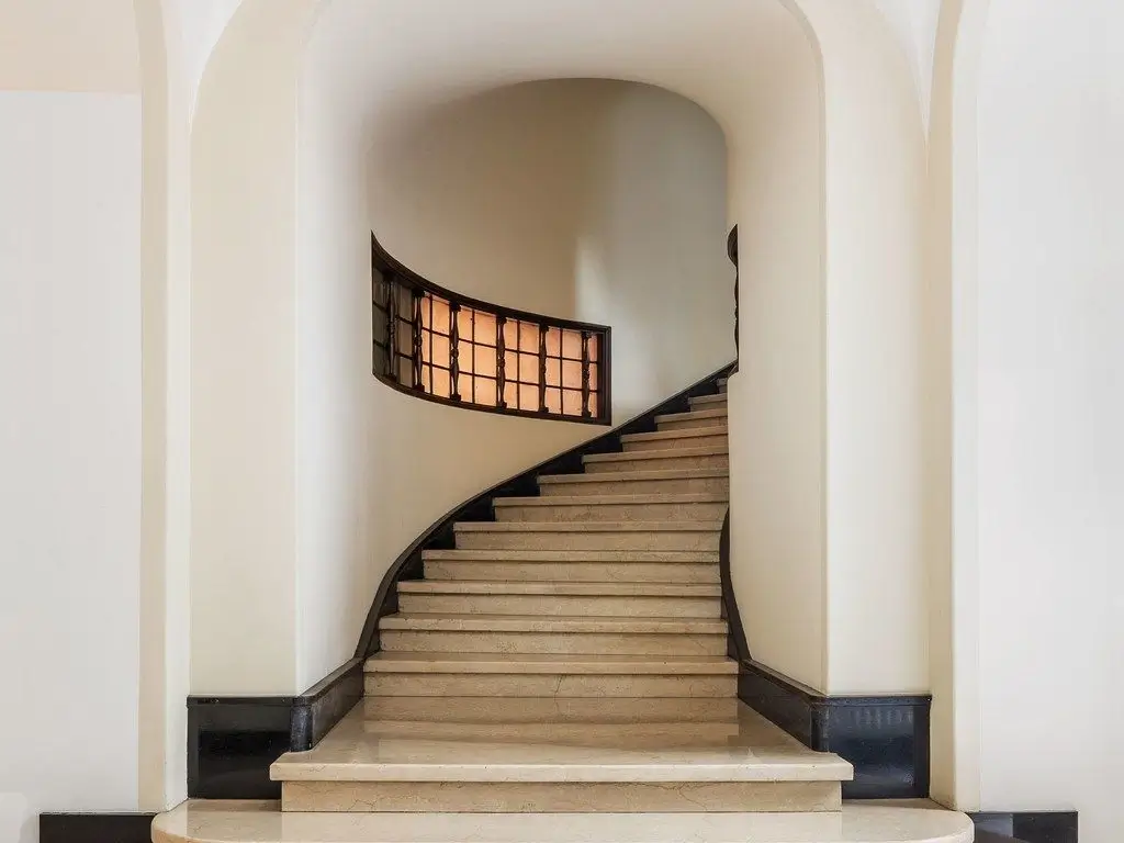 A photograph of the finished, beautifully crafted staircase