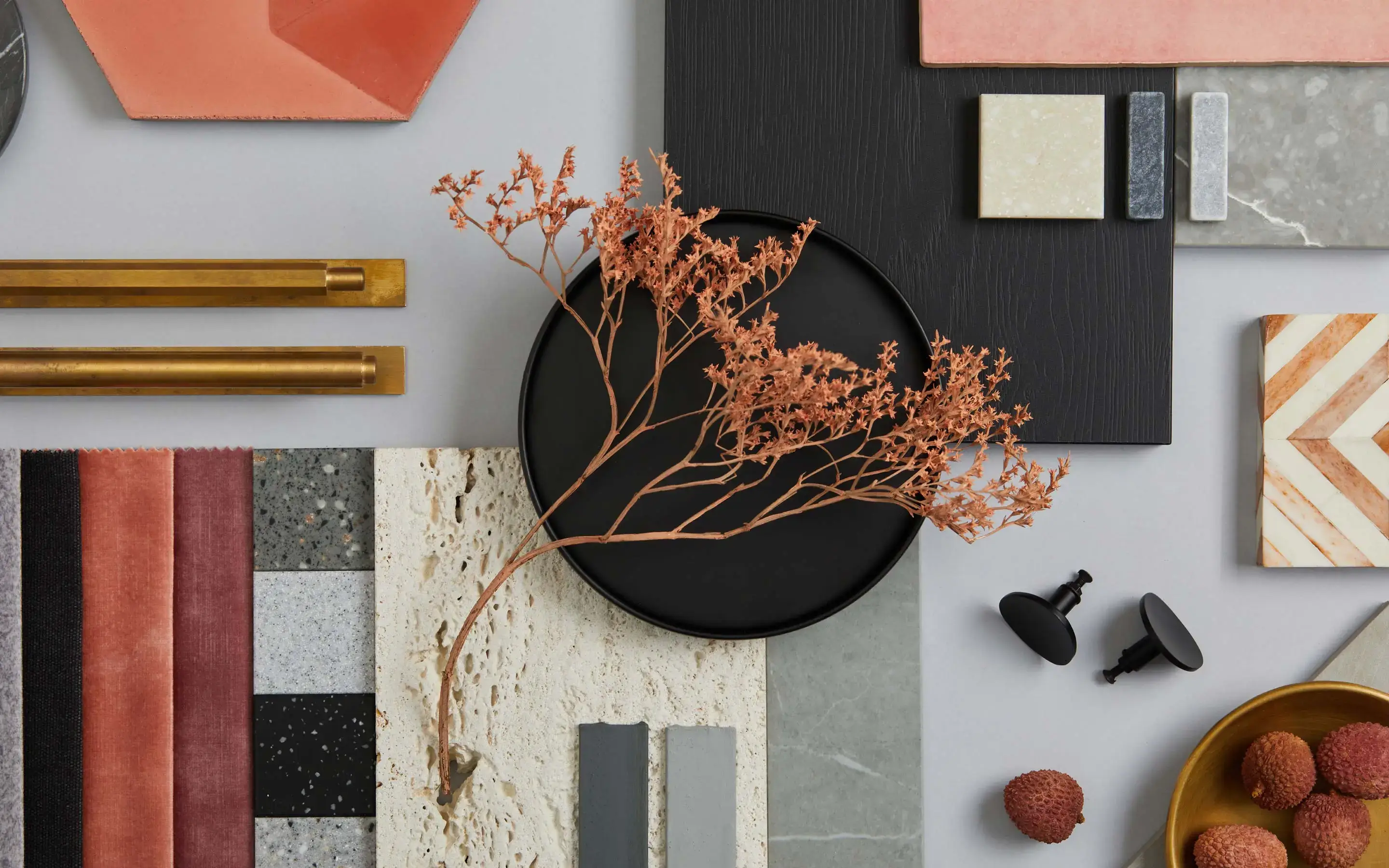 A creative flat lay of sketches, material samples, and design books